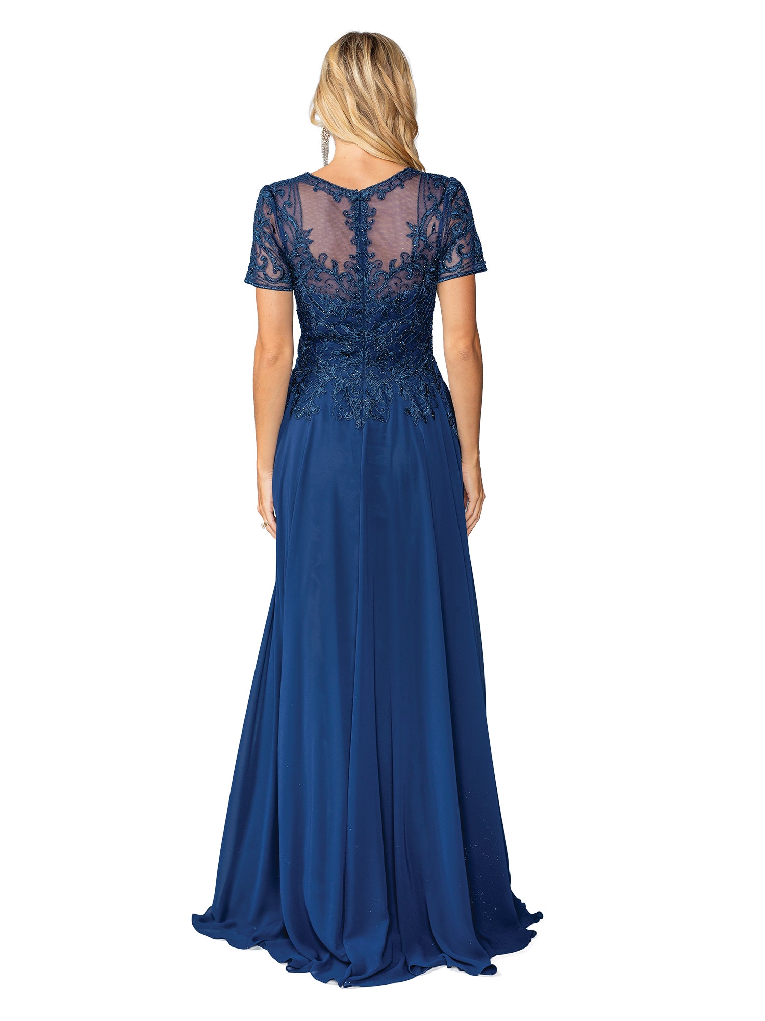 A woman, seen from behind, wears the Dancing Queen 4445 short-sleeve long formal dress in navy blue, featuring an embroidered-lace bodice and a sheer back.